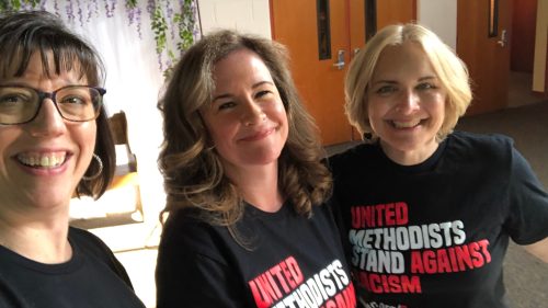 three women wearing t-shirts that read United Methodists Stand Against Racism